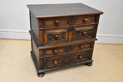 Lot 1005 - A 19th century oak chest of four drawers,...
