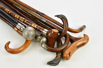 Lot 1454 - A collection of walking canes and sticks, four...