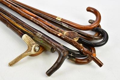 Lot 1455 - A collection of walking sticks and canes...