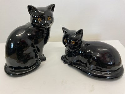 Lot 196 - A pair of black ceramic cats in the style of...