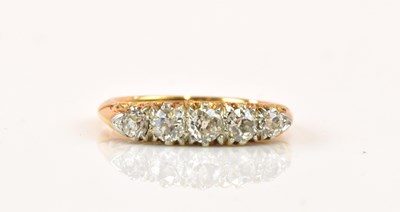 Lot 1247 - An 18ct yellow gold five stone graduated...