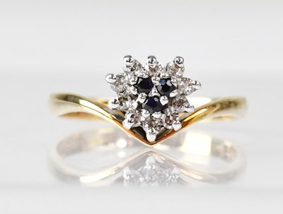 Lot 617 - A 9ct gold ring set with ten small diamonds...