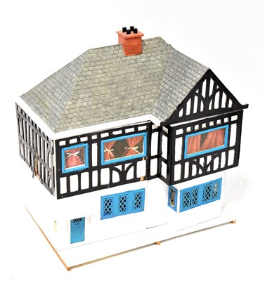 Lot 419 - A Tudor-style dolls' house, double front door...