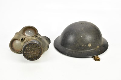 Lot 1199 - A WWII army helmet and gas mask.