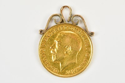 Lot 68 - A 9ct gold mounted George V full sovereign, 1914.