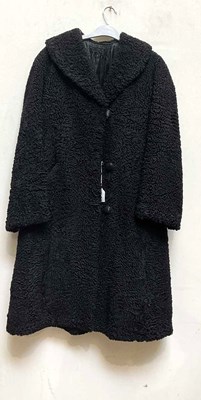 Lot 917 - A full length vintage 1950s black astrakhan...