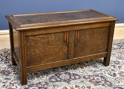 Lot 2463 - A 1950s oak blanket chest with panelled front...