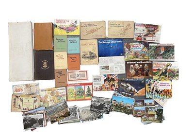 Lot 469 - A large quantity of postcards, badges and...