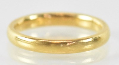 Lot 1266 - A 22ct yellow gold wedding band, size L,...