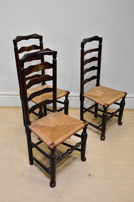 Lot 1059 - A set of three late 18th century rush seated...