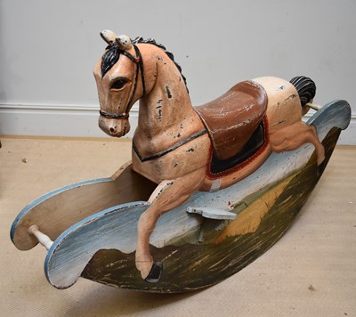 Lot 1602 - A large decorative carved and painted rocking...