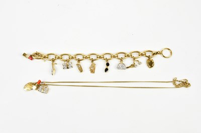 Lot 877 - HARRODS; a gold tone chain with lipstick charm...