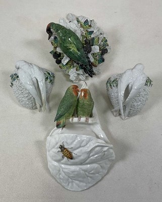 Lot 210 - Four Continental porcelain wall pockets,...