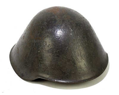 Lot 507 - A post World War II East German army helmet...