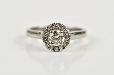 Lot 37 - A white metal and diamond halo ring, with...