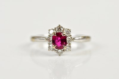 Lot 89 - An 18ct white gold ruby and diamond ring, size...