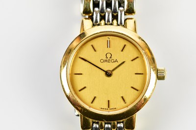 Lot 631 - OMEGA; a lady's bi-metallic wristwatch with...
