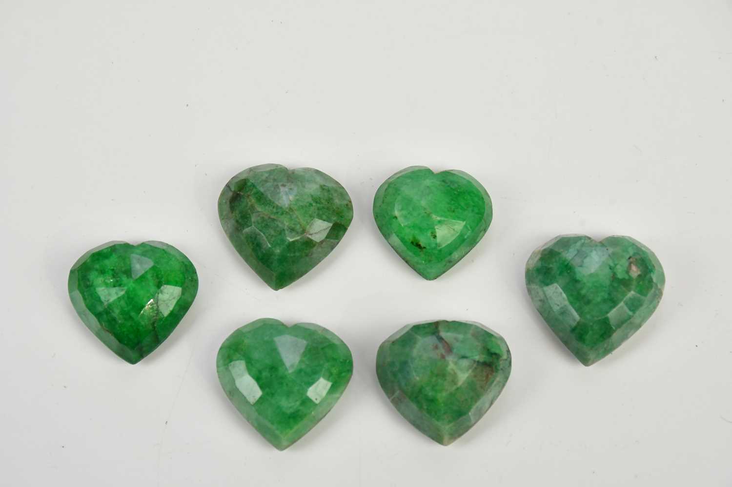 Lot 472 - Seven heart shaped natural emeralds (7) PLEASE...