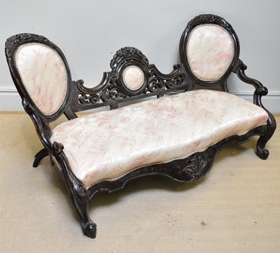 Lot 1026 - A Victorian carved and stained wood settee on...