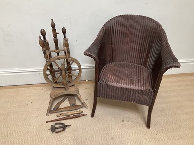 Lot 1121 - A vintage spinning wheel and a Lloyd Loom type...