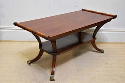 Lot 1201 - A reproduction mahogany two tier coffee table...