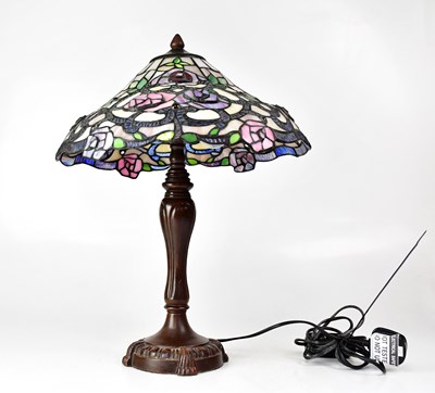 Lot 116 - A Tiffany-style table lamp, the shade with...