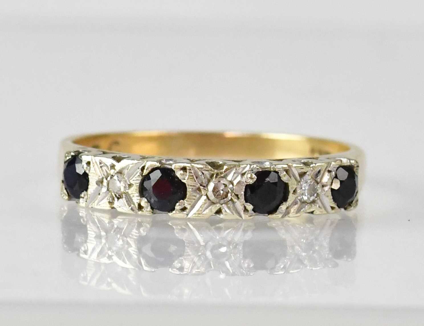 Lot 1104 - A 9ct gold half eternity ring illusion set...