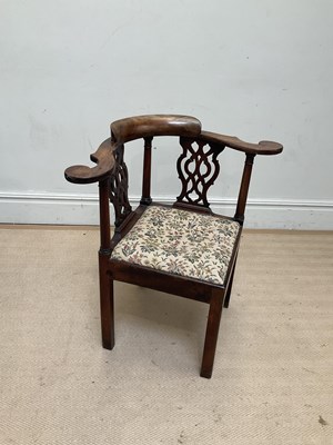Lot 1049 - A George III mahogany corner chair, with two...