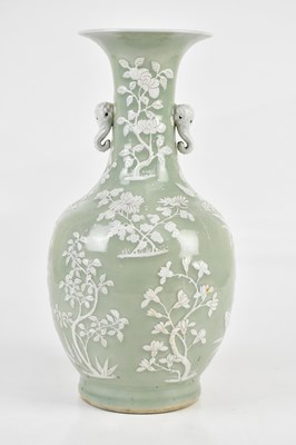 Lot 1053 - A Chinese celadon ground vase, with twin...