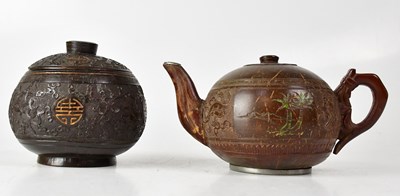 Lot 308 - A Chinese carved coconut teapot with metal...