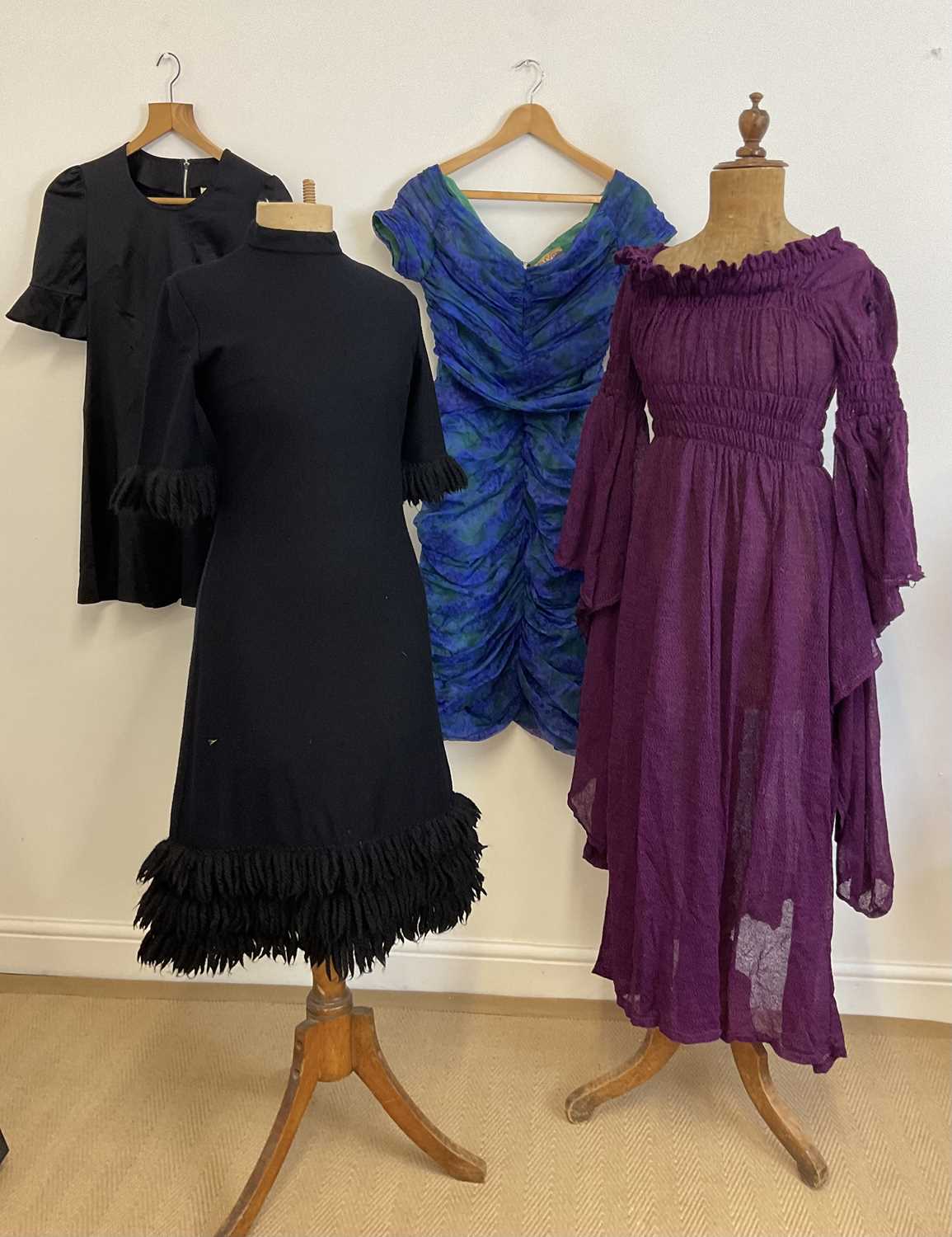 Lot 148 - A group of 1960s dresses including a black...