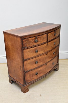 Lot 1027 - An early 19th century mahogany bowfront chest,...