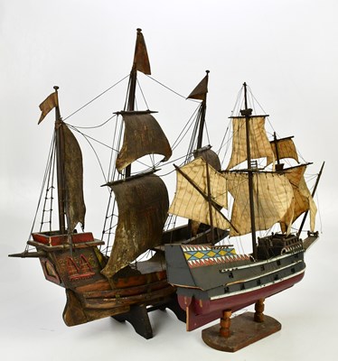 Lot 1447 - Two wooden model boats on stands, height of...