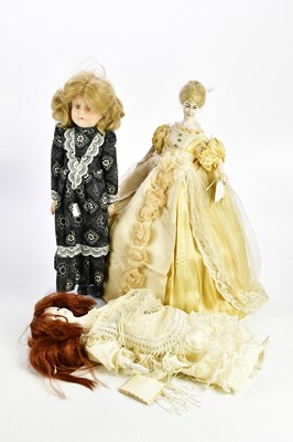 Lot 1625 - Three vintage dolls including a painted wooden...