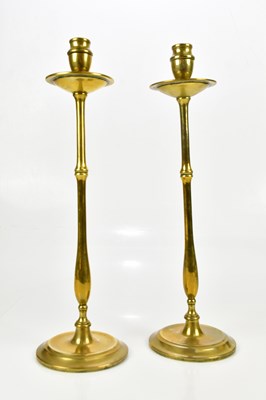Lot 1578 - A pair of 19th century brass taper sticks,...