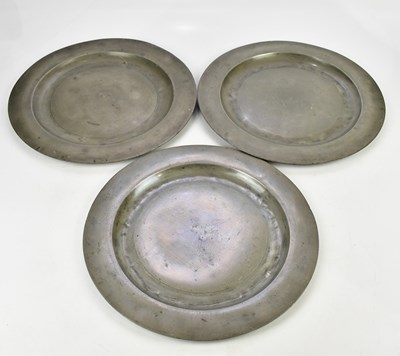 Lot 1558 - Three early 19th century pewter plates, one...