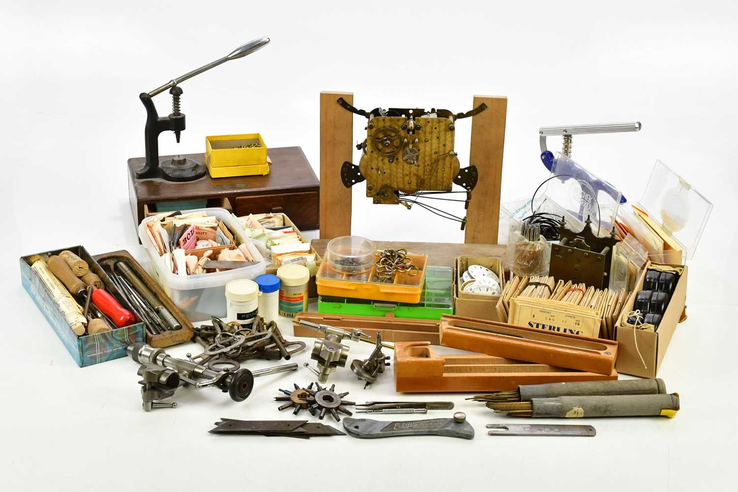 Lot 706 - A collection of pocket watch parts, tools,...