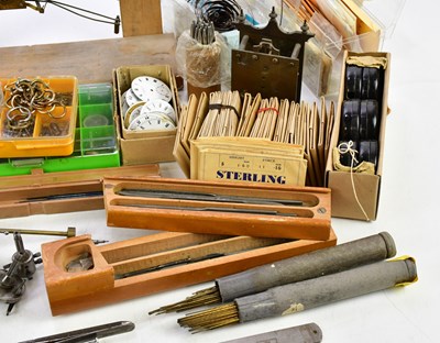 Lot 706 - A collection of pocket watch parts, tools,...