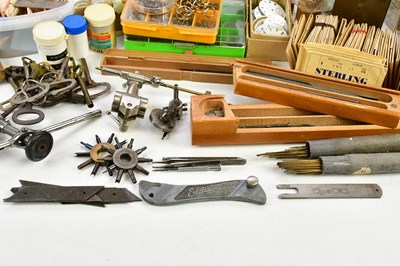Lot 706 - A collection of pocket watch parts, tools,...