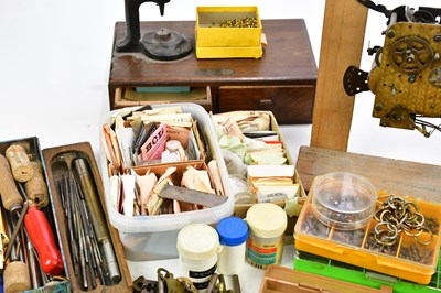 Lot 706 - A collection of pocket watch parts, tools,...