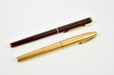 Lot 1391 - SHEAFFER; a gold plated fountain pen with...