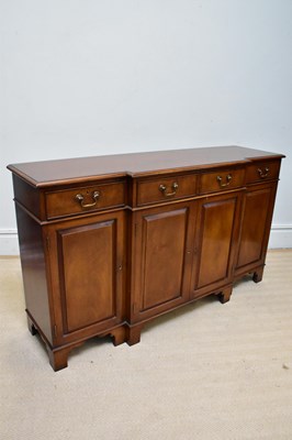 Lot 1186 - A reproduction mahogany breakfront sideboard,...
