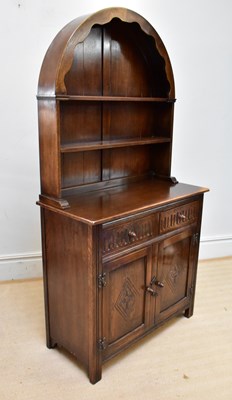 Lot 1118 - An oak Priory style dresser with arched plate...