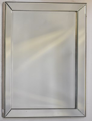 Lot 127 - A contemporary mirror with bevelled mirror...