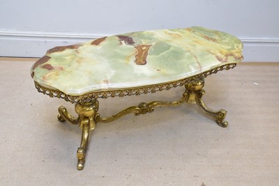Lot 1208 - A brass framed coffee table with shaped onyx...