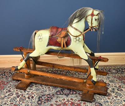 Lot 179 - A painted wooden rocking horse circa 1900, on...