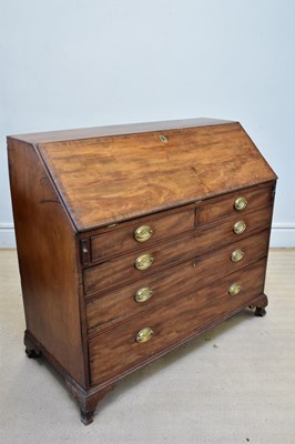 Lot 1054 - A Georgian crossbanded mahogany bureau, the...