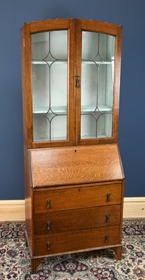 Lot 2905 - A 1920s oak bureau bookcase, the upper section...