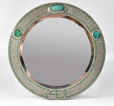 Lot 122 - An Arts & Crafts pewter framed circular mirror...