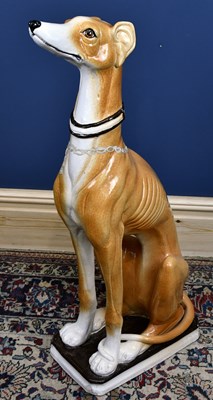 Lot 542 - A large ceramic model of a seated lurcher,...